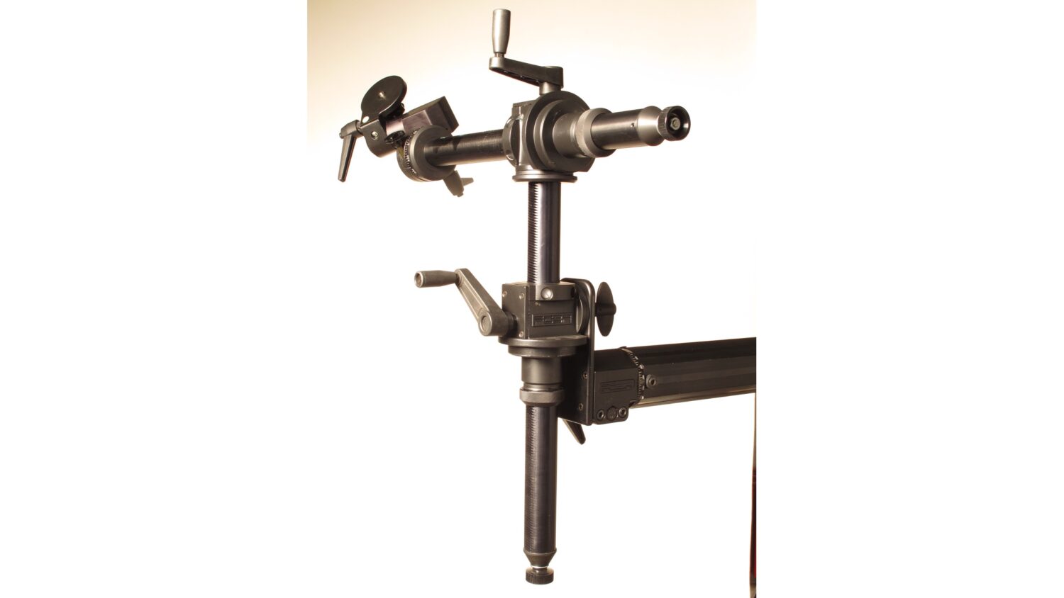 FOBA tripod accessories and tilting head mounted on a studio stand